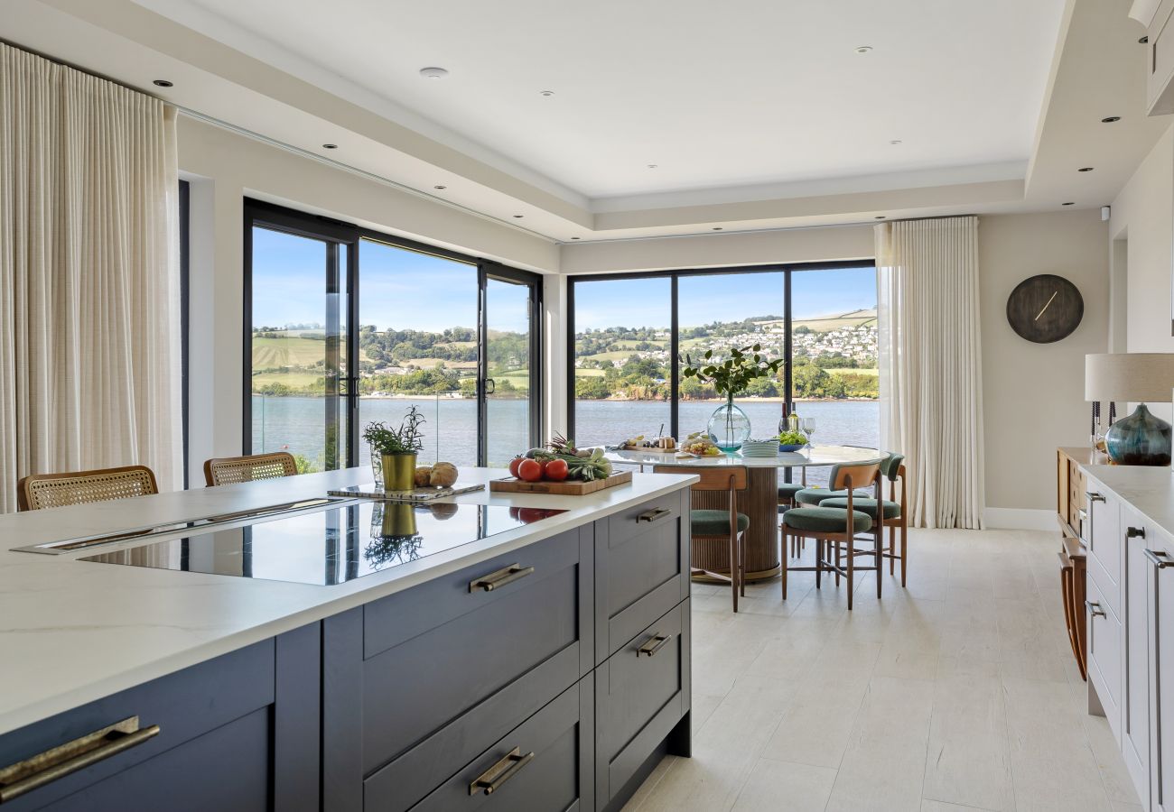 L-shaped kitchen / dining room with views